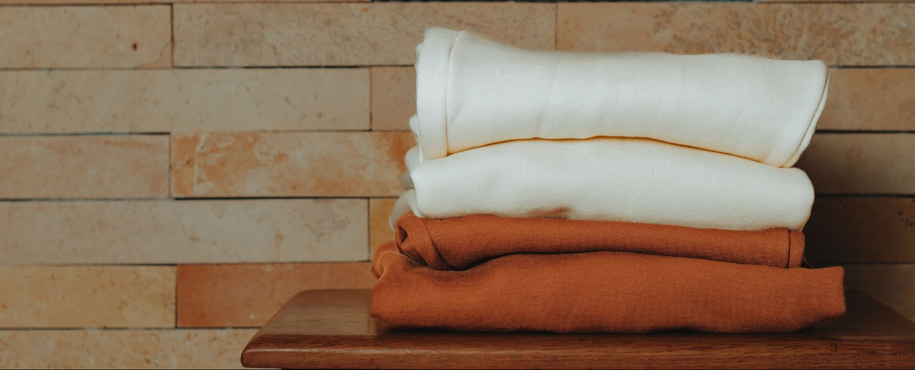 Stacked images of folded clothes
