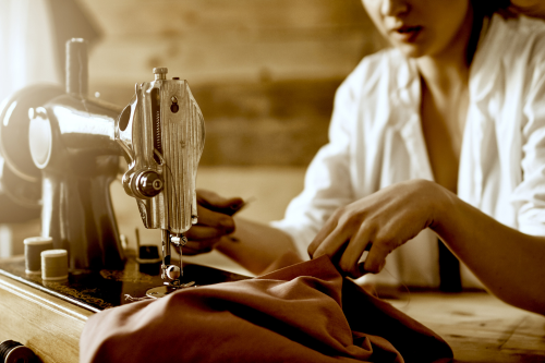 Woman works at sewing machine