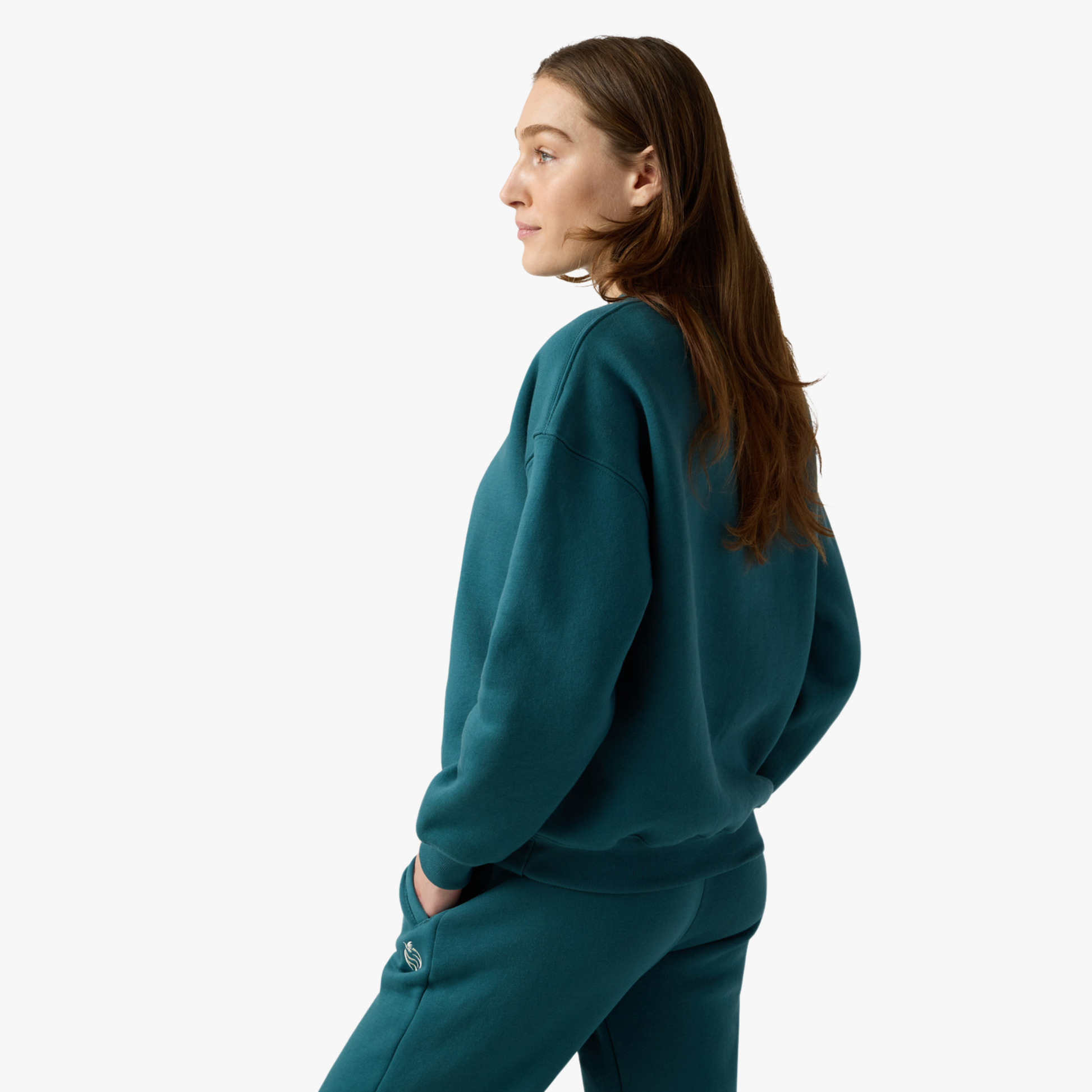 Female model poses sideways wearing fleece set