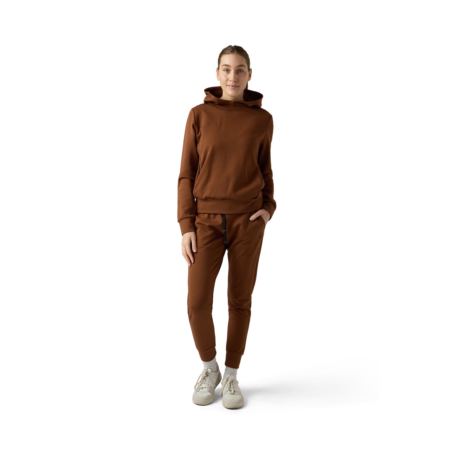 Female model wears brown funnel neck set
