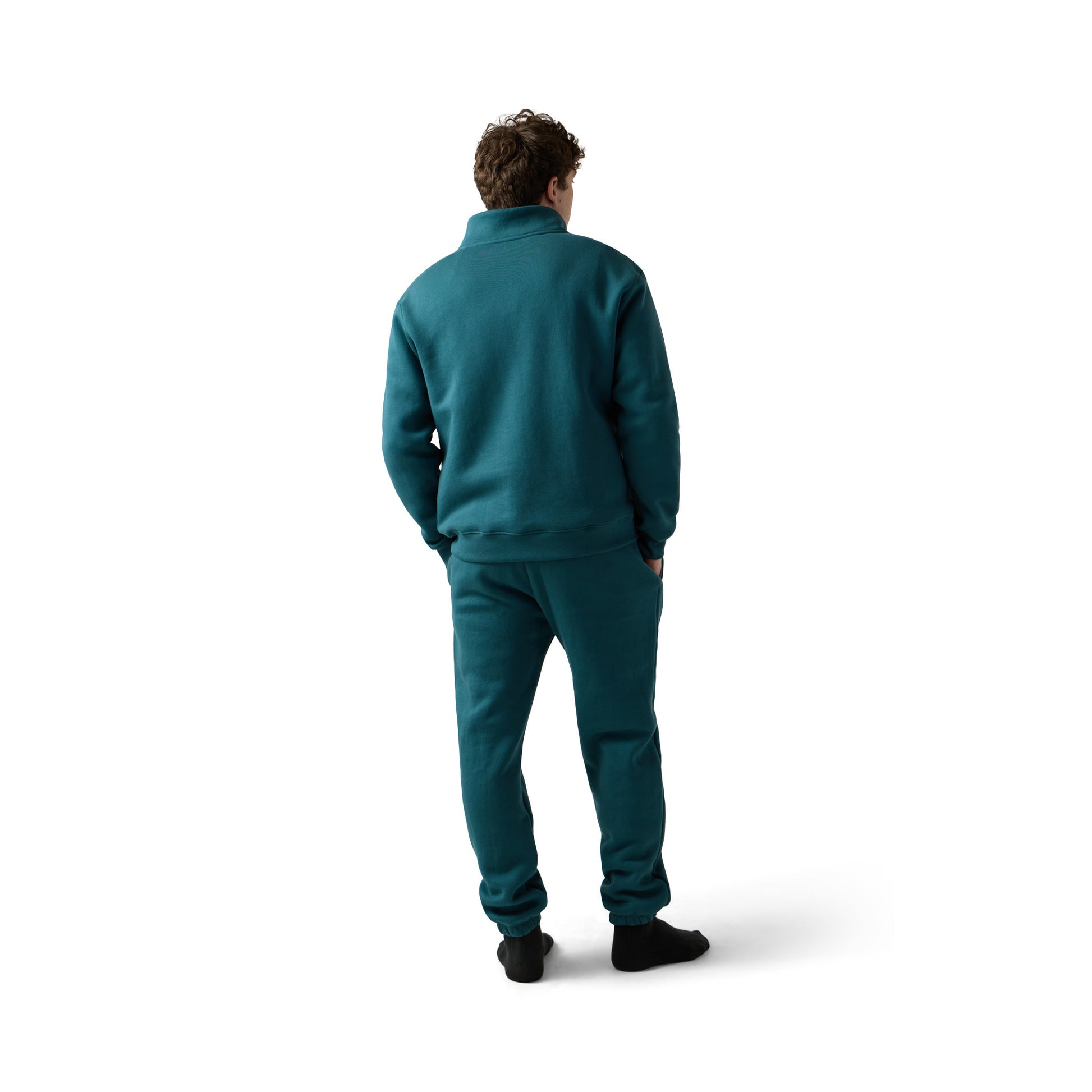 Male model wears teal sweatpants set