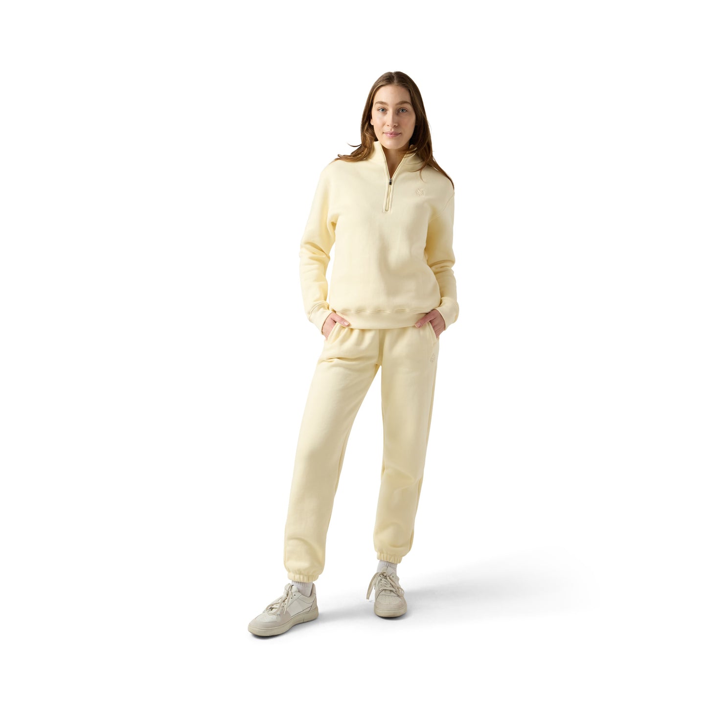 Female model wears beige set