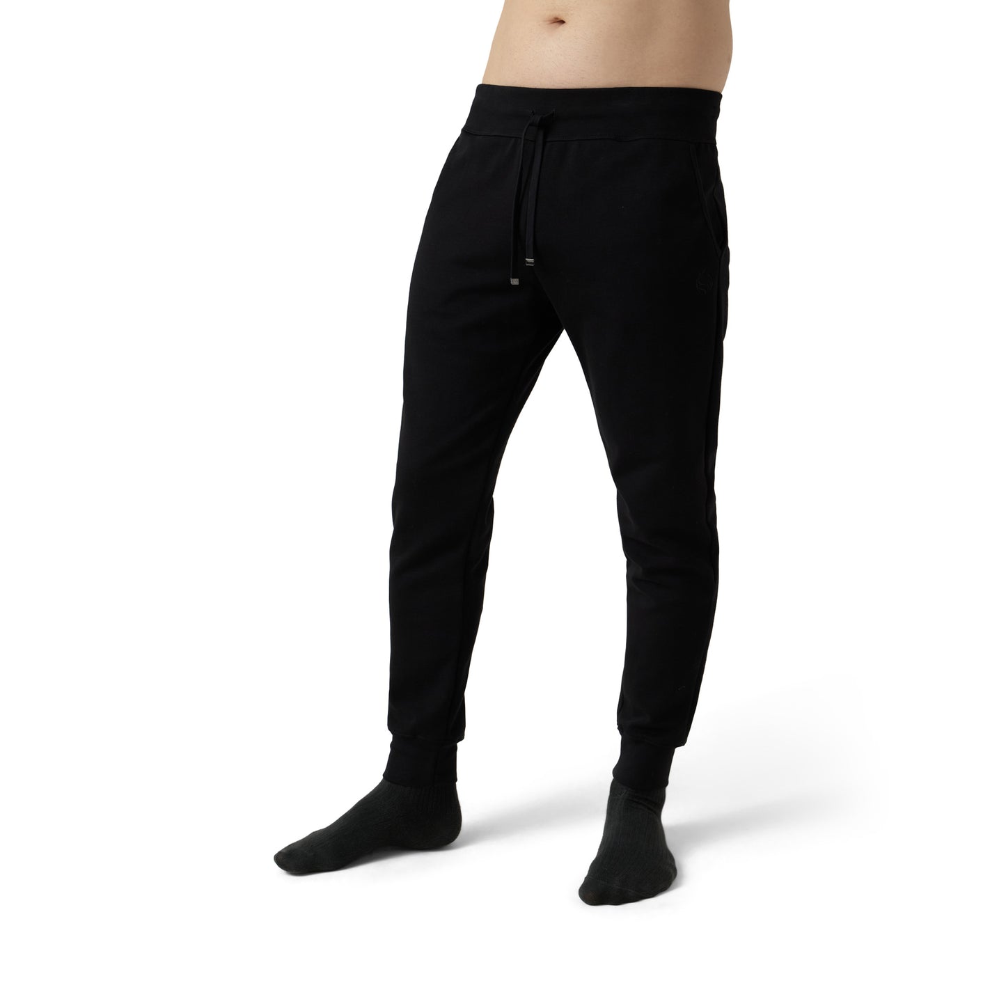 Male model wears black joggers