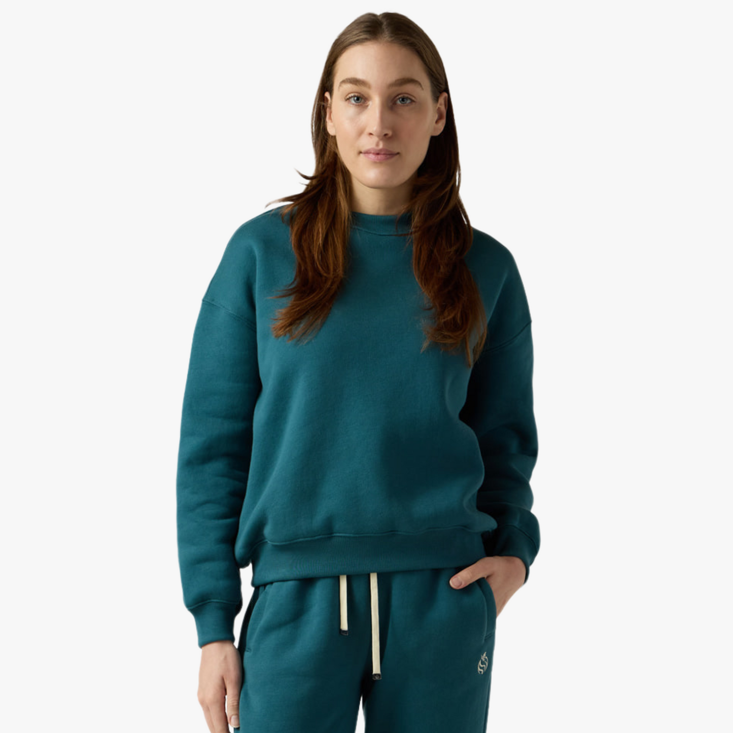Female model wears teal crewneck and sweatpants set