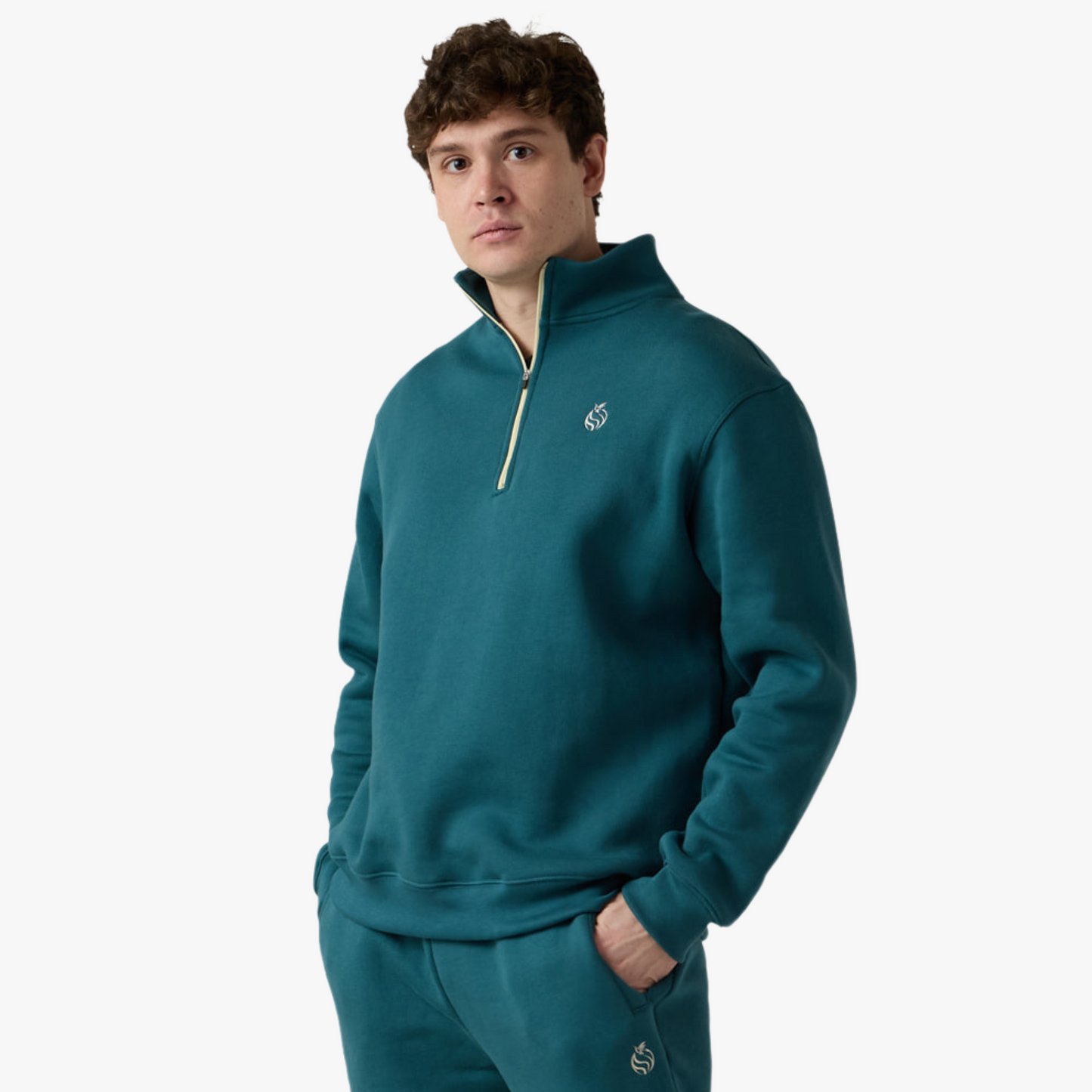 Male model wears teal half zip fleece