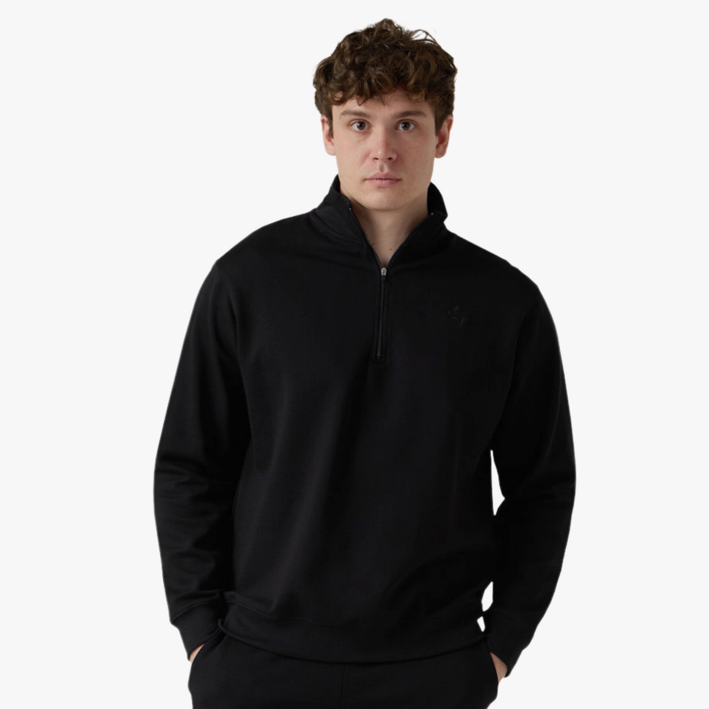 Male model wears black half zip