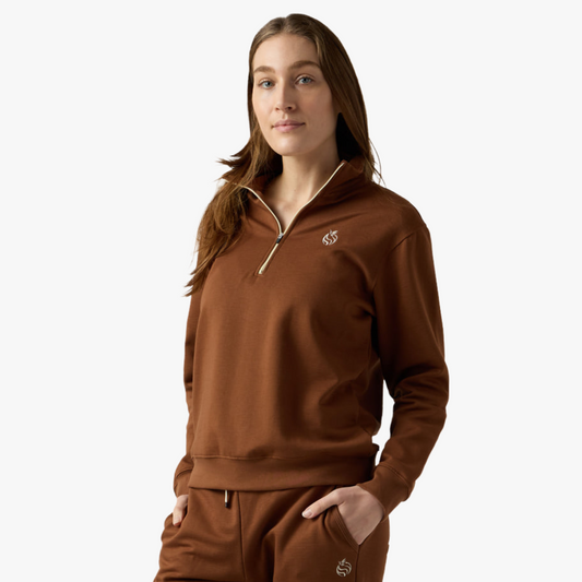 Female model wears brown half zip 